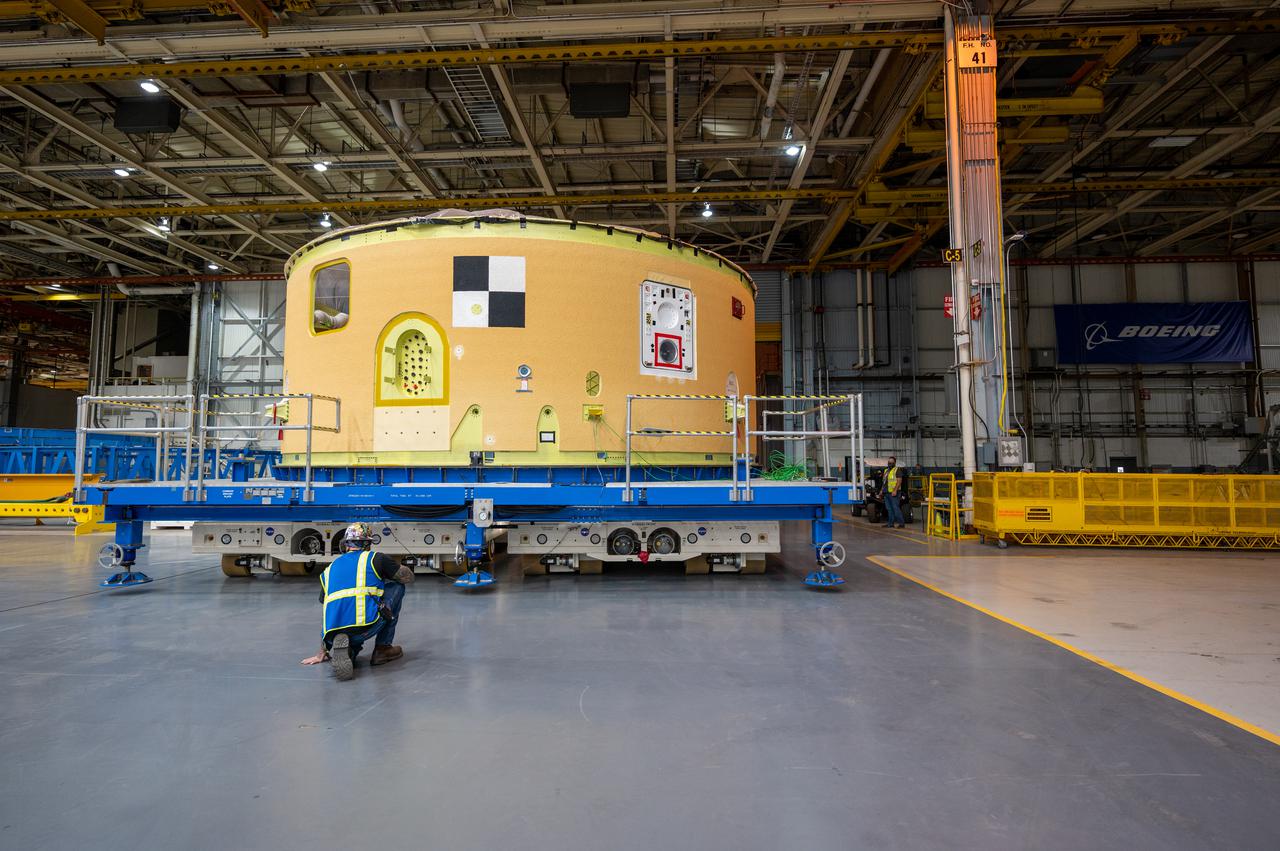 This image shows the forward skirt that will be used on the core stage of NASA’s Space Launch System rocket for Artemis II, the first crewed mission of NASA’s Artemis program, at NASA’s Michoud Assembly Facility. The SLS core stage is made up of five unique elements: the forward skirt, liquid oxygen tank, intertank, liquid hydrogen tank, and the engine section. The forward skirt houses flight computers, cameras, and avionics systems. The hardware is located at the top of the 212-foot-tall core stage and connects the upper part of the rocket to the core stage. Soon, technicians will ready the forward skirt for the first of three core stage assembly mates called the forward join. The forward join consists of three main parts -- the forward skirt, liquid oxygen tank, and intertank – to create the top, or forward part, of the core stage. Together with its four RS-25 engines, the rocket’s massive 212-foot-tall core stage — the largest stage NASA has ever built — and its twin solid rocket boosters will produce 8.8 million pounds of thrust to send NASA’s Orion spacecraft, astronauts and supplies beyond Earth’s orbit to the Moon and, ultimately, Mars. Offering more payload mass, volume capability and energy to speed missions through space, the SLS rocket, along with NASA’s Gateway in lunar orbit, the Human Landing System, and Orion spacecraft, is part of NASA’s backbone for deep space exploration and the Artemis lunar program. No other rocket is capable of carrying astronauts in Orion around the Moon in a single mission.